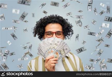 finance, currency and people concept - happy man holding hundreds of dollar money banknotes over grey background. happy man with dollar money