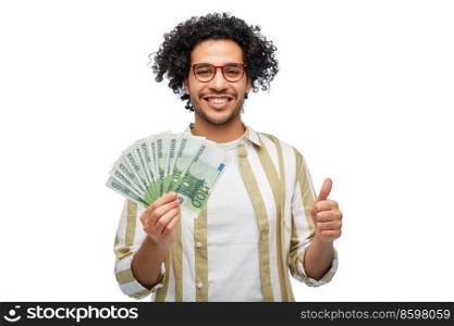finance, currency and people concept - happy man holding hundreds of euro money banknotes showing thumbs up over white background. happy man with euro money showing thumbs up