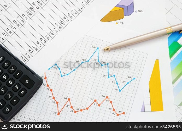 Finance documents with pen and calculator. Finance documents