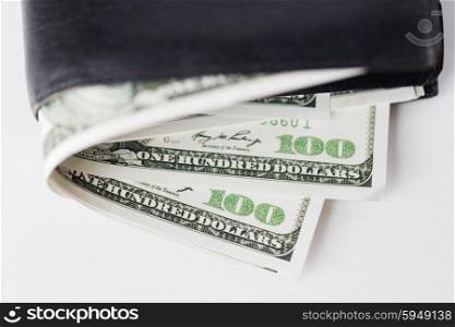 finance, investment, saving and cash concept - close up of dollar money in wallet