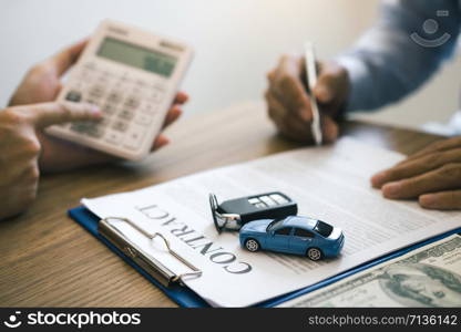 Finance manager of the car showroom is calculating the cost of reserving a new car for the customer while signing a car purchase contract.