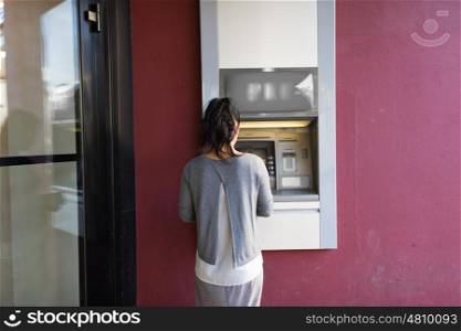 finance, money, bank and people concept - close up of woman at atm machine outdoors