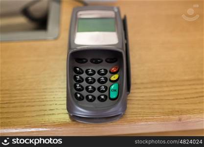 finance, money, technology, payment and people concept - close up of bank card reader or atm terminal