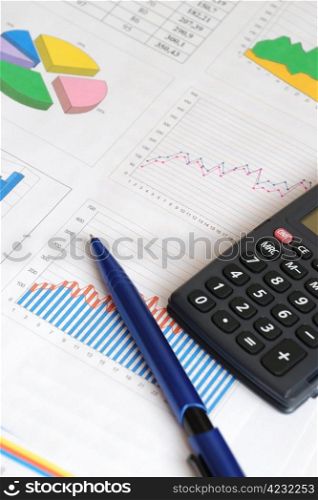 Finance report with a pen and calculator. Finance report