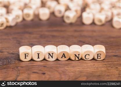 finance text wooden dices