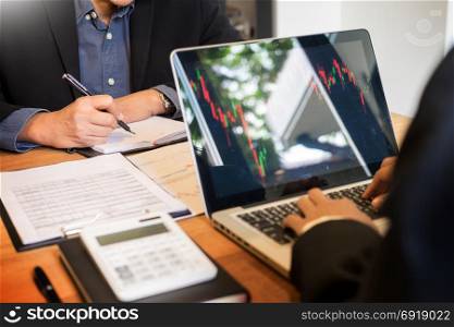 Finance trade manager showing reports screen analysis finance currency data on stock trade graph on business currency market.