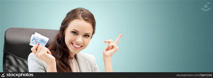 finances, people, savings and investment concept - happy business woman with euro cash money over blue background
