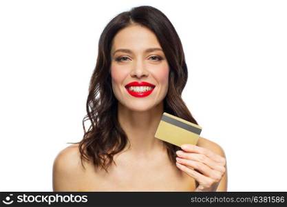 finances, shopping and people concept - happy smiling young woman with red lipstick holding credit card over white background. beautiful woman with red lipstick and credit card