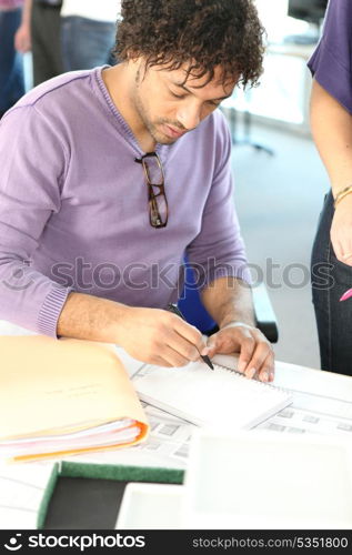 Financial adviser working at his desk