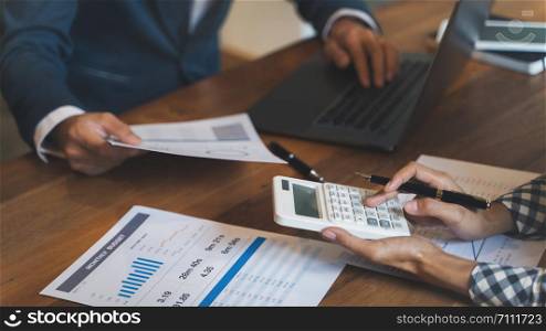 Financial analyst calculating with number documents, Investment concept.