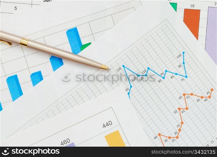 Financial chart and a pen. Financial chart