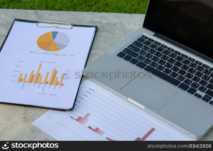 Financial chart with computer laptops.