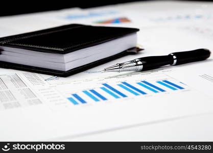 financial charts and graphs on the table