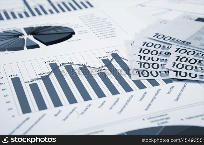 financial charts and graphs on the table