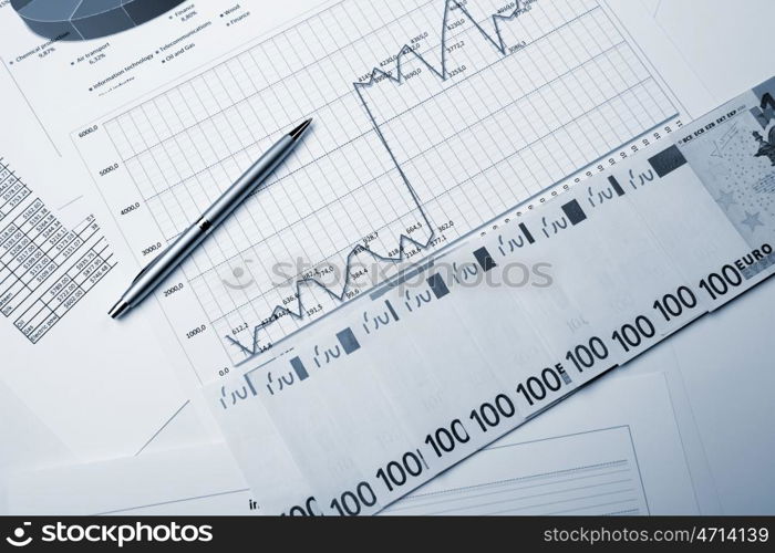 financial charts and graphs on the table