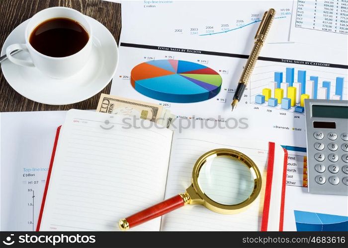 Financial charts and graphs on the table. financial charts and graphs and a pen on the office table