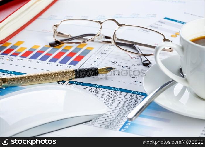 Financial charts and graphs on the table. financial charts and graphs and a pen on the office table