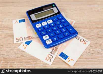Financial concept. Euro money. Euro notes with calculator