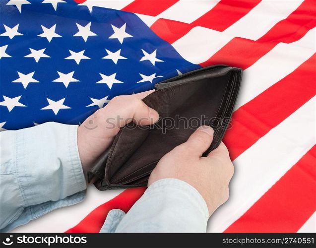 Financial Crisis in United States - Man&rsquo;s Hand With Empty Wallet and Flag of USA