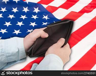Financial Crisis in United States - Man&rsquo;s Hand With Empty Wallet and Flag of USA