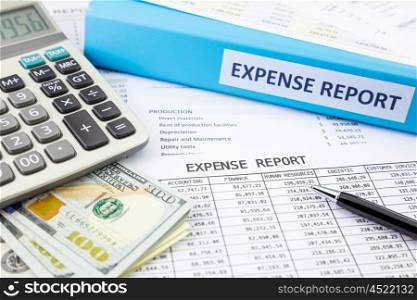 Financial expense report with banknotes and calculator