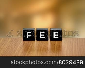 financial fee on black block with blurred background