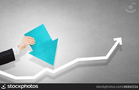 Financial growth and increase. Hand holding arrow representing business growth concept