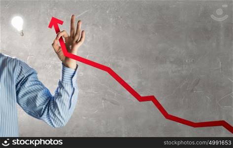 Financial growth concept. Close view of man showing ok gesture and arrow growing graph