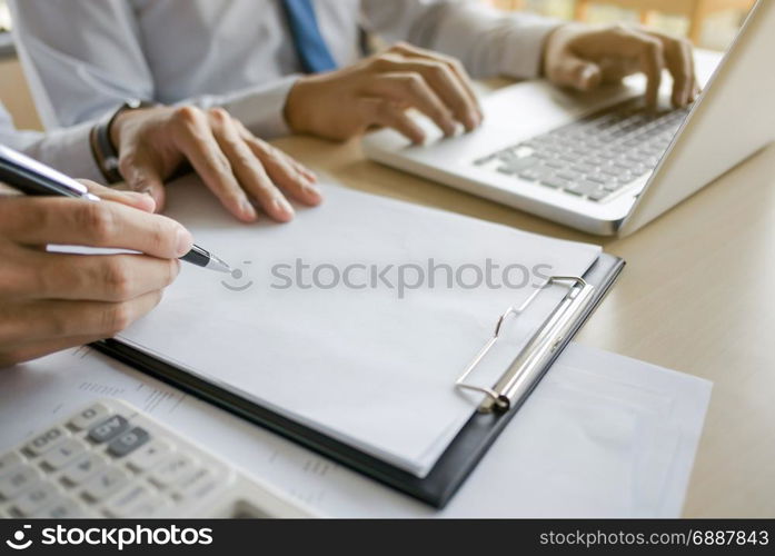 financial inspector making report,insurance agent analyzing about home investment loan at office room