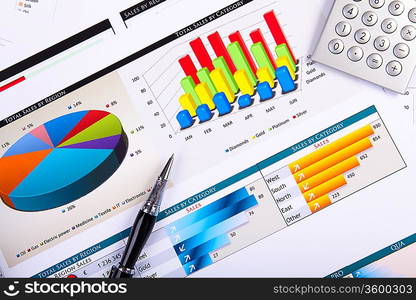 Financial paper charts and graphs on the table