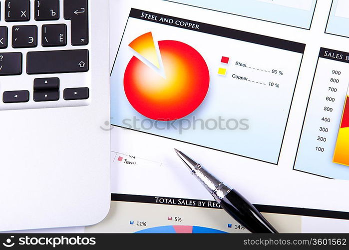 Financial paper charts and graphs on the table