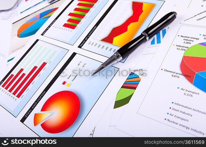 Financial paper charts and graphs on the table