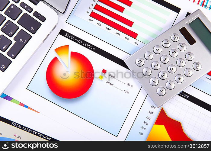 Financial paper charts and graphs on the table