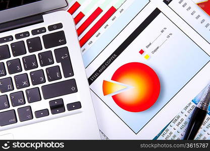 Financial paper charts and graphs on the table