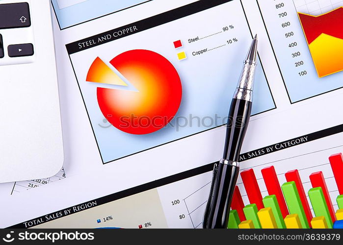 Financial paper charts and graphs on the table