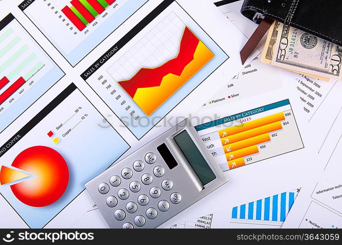 Financial paper charts and graphs on the table