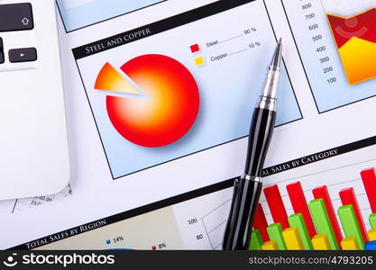 Financial paper charts and graphs on the table