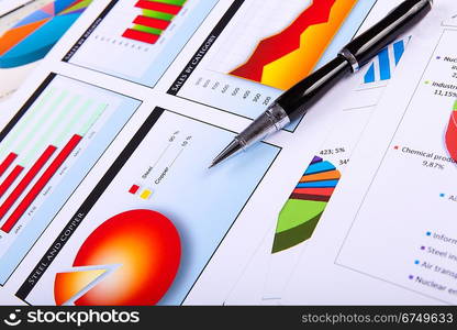 Financial paper charts and graphs on the table