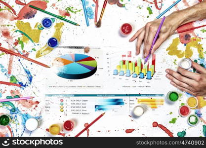 Financial pie drawing. People hands drawing business growth concept with paints