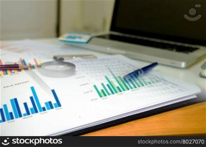 financial plan and pen,computer on desk.Business Concept
