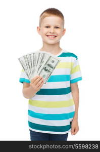 financial, planning, childhood and educational concept - smiling boy holding dollar cash money in his hand