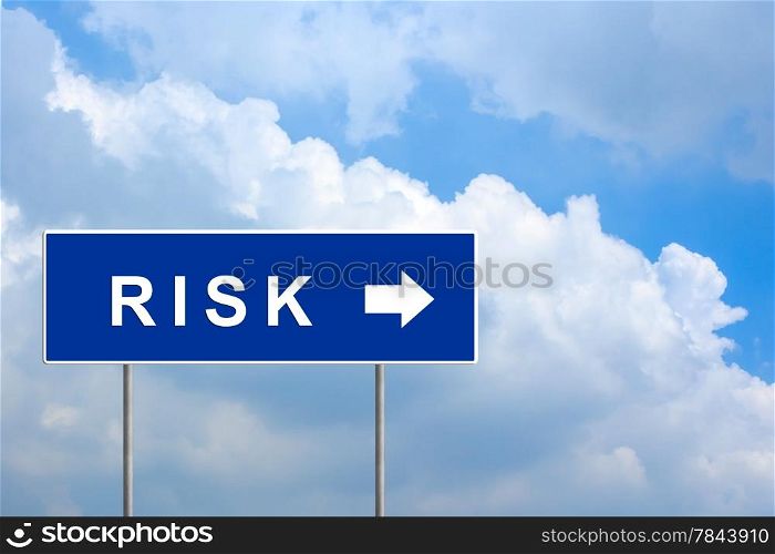 financial risk on blue road sign with blue sky