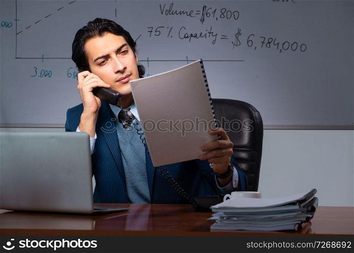 Financial specialist working late in the office