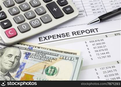 Financial summary report with dollar banknotes and calculator, focus on Expense report word