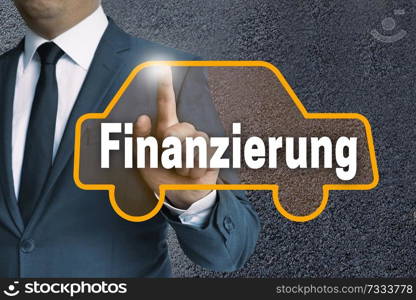 finanzierung (in german finance) car touchscreen operated by businessman concept.. finanzierung (in german finance) car touchscreen operated by businessman concept