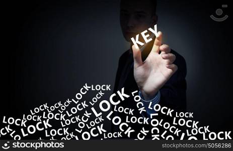 Find right key. Male hand taking key glowing word with fingers