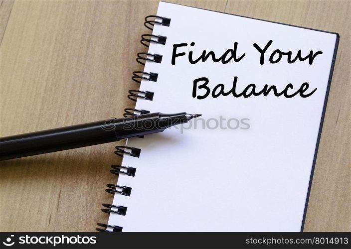 Find your balance text concept write on notebook with pen