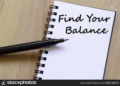 Find your balance text concept write on notebook with pen