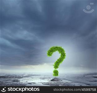 Finding answer. Conceptual image of plant in pot shaped like question mark