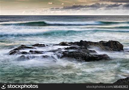 fine art image of strong and resilient rocks at the sea. rocks at the sea